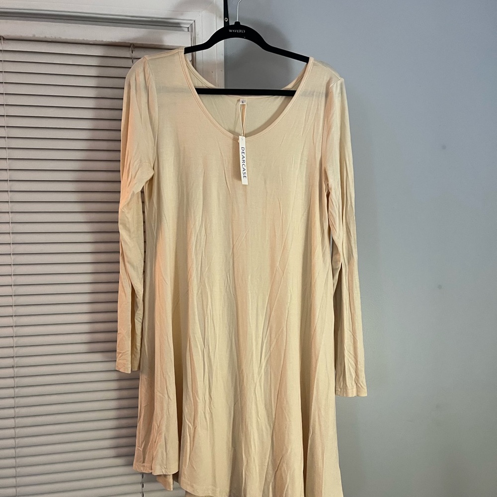 Women’s Large long-sleeved, lightweight cream mid dress. Never worn with tags.
